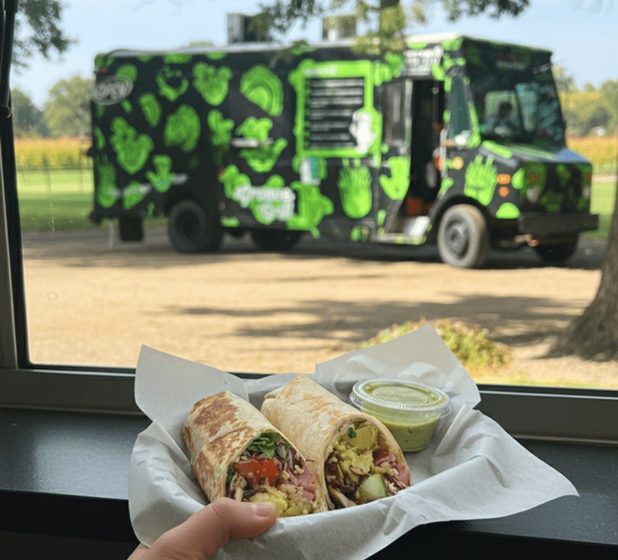 A vibrant food truck with a mushroom theme serving meals